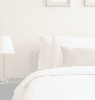 White comfortable pillow on bed decoration interior of bedroom